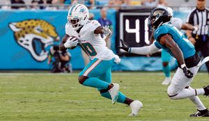 Daewood Davis of Dolphins carted off field after collision; preseason game  vs. Jaguars halted – KXAN Austin