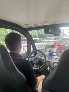 Circuit driver ambassador Josh Martin moves through downtown Bellevue traffic. (Paige Cornwell / The Seattle Times)