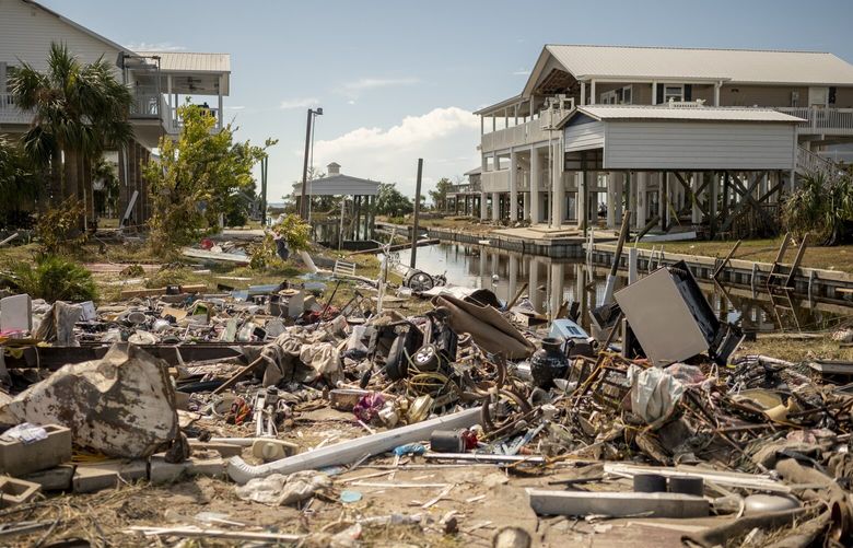 Residents pick through the rubble of lost homes and scattered belongings in  Hurricane Idalia's wake