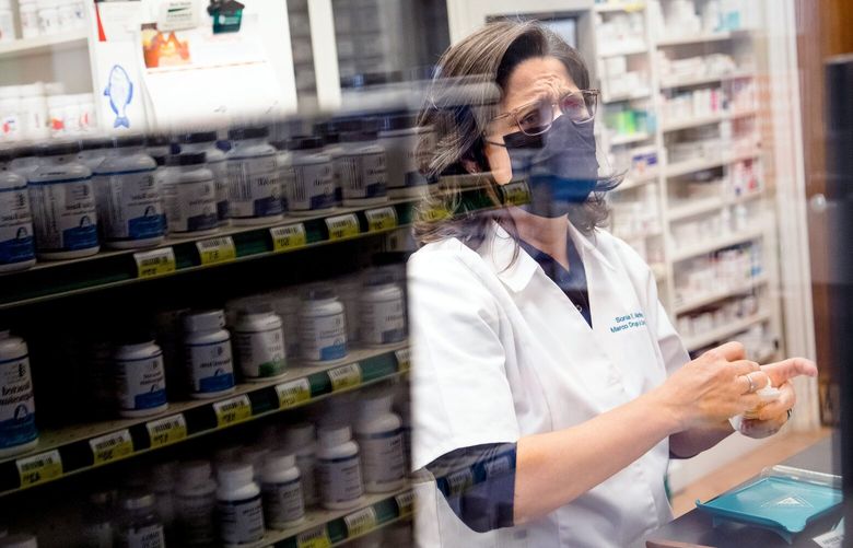 FILE – A compound pharmacist works to fill prescriptions in Miami on Feb. 3, 2022. The Biden administration announced the first 10 medicines that will be subject to price negotiations with Medicare on Aug. 29, 2023, kicking off a landmark program that is expected to reduce the government’s drug spending but is being fought by the pharmaceutical industry in court. (Scott McIntyre/The New York Times) XNYT0983 XNYT0983