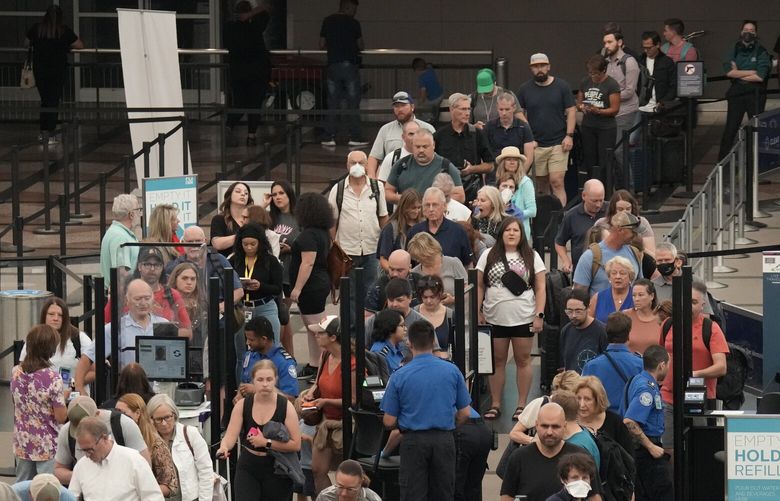 Passengers queue up at the north security checkpoint in Denver International Airport Friday, Sept. 1, 2023, in Denver. Officials expect more than 400,000 passengers to filter through Denver International during the Labor Day holiday. (AP Photo/David Zalubowski) CODZ110 CODZ110