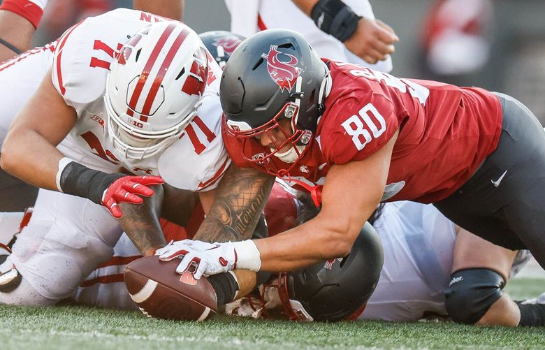 Washington State edge rusher Brennan Jackson recovers the Wisconsin fumble in the first half.  The Wisconsin Badgers played the Washington State University Cougars in NCAA Football Saturday, Sept. 9, 2023 at Martin Stadium, in Pullman, WA. 224934