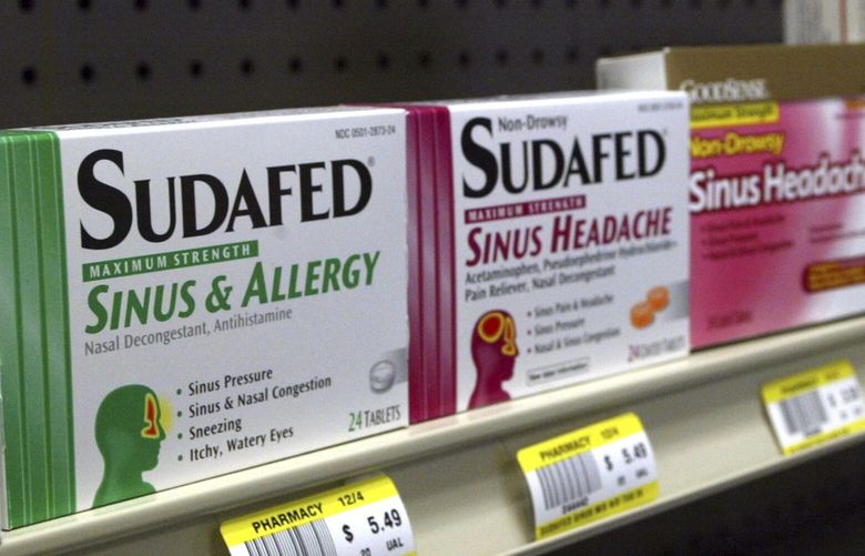 FILE – Sudafed and other common nasal decongestants containing pseudoephedrine are on display behind the counter at Hospital Discount Pharmacy in Edmond, Okla., Jan. 11, 2005. The leading decongestant used by millions of Americans looking for relief from a stuffy nose is likely no better than a dummy pill, according to government experts who reviewed the latest research on the long-questioned drug ingredient. Advisers to the Food and Drug Administration voted unanimously on Tuesday, Sept. 12, 2023 against the effectiveness of the ingredient found in popular versions of Sudafed, Allegra, Dayquil and other medications sold on pharmacy shelves. (AP Photo, File) NYPH901 NYPH901
