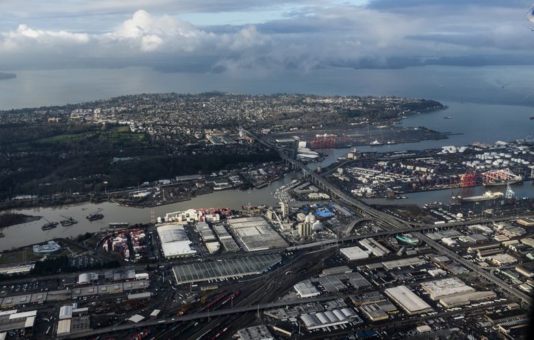 The Duwamish River’s West and East waterways flow around Harbor Island into Elliott Bay, with Sodo in the foreground and West Seattle in the background. The Duwamish, Seattle’s only river, is a longtime source of food, tradition and culture for Indigenous people. (Bettina Hansen / The Seattle Times, 2015)