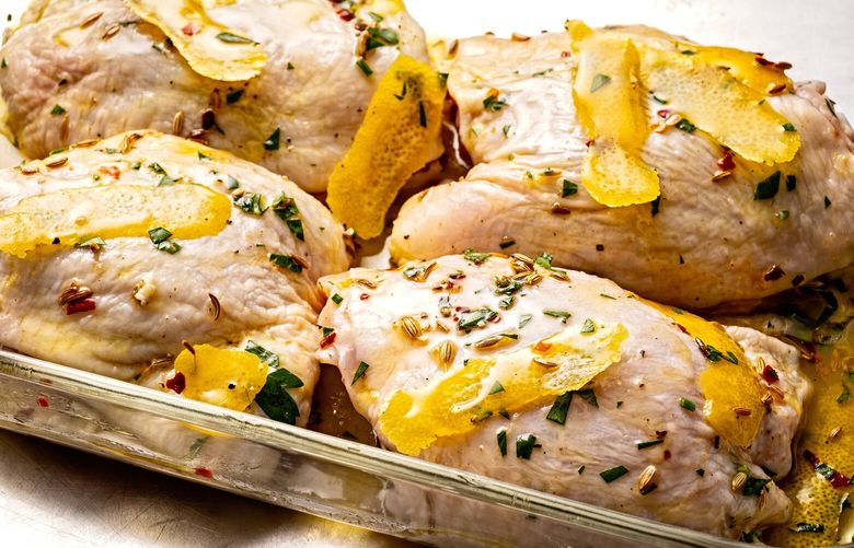 Marinating chicken thighs. MUST CREDIT: Photo for The Washington Post by Scott Suchman; food styling for The Washington Post by Lisa Cherkasky