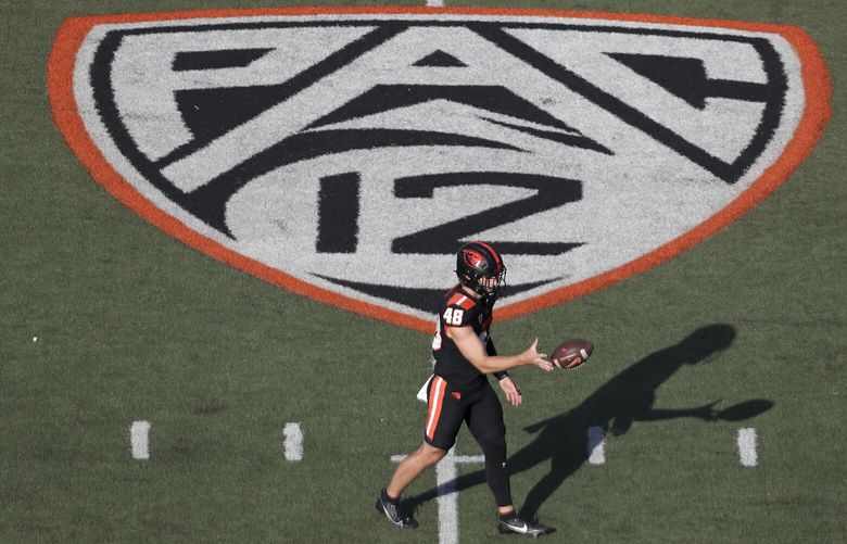 Oregon State long snapper Dylan Black (48) warms up near a Pac-12 logo on the field at Reser Stadium before an NCAA college football game against UC Davis Saturday, Sept. 9, 2023, in Corvallis, Ore. Oregon State won 55-7. (AP Photo/Amanda Loman) NYOTK NYOTK