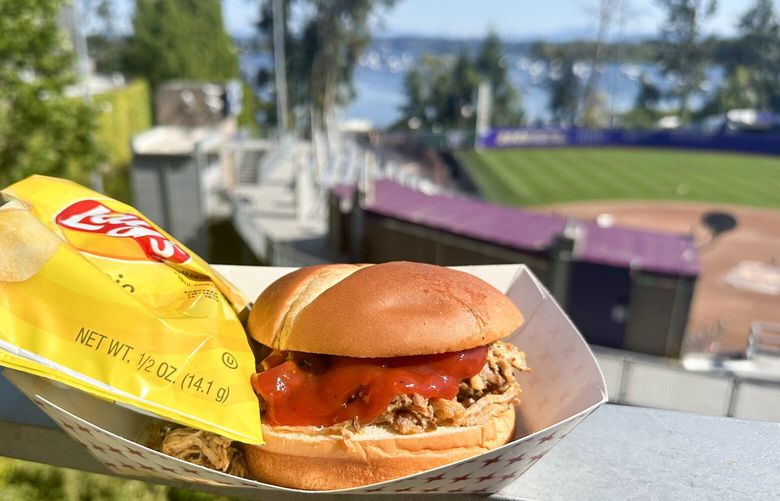 This pulled pork sandwich with chips for $14.49 was the best food deal we found at Husky Stadium
