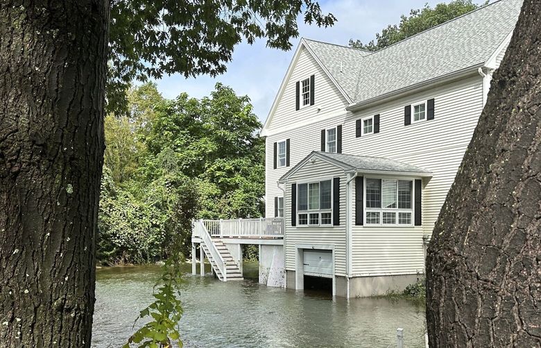 A home was flooded in Leominster Massachusetts following overnight flooding in the state. (AP Photo/Michael Casey) RPMC208 RPMC208