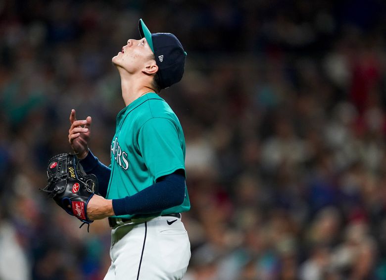 Boston Red Sox pitcher Matt Clement sits on the mound after being