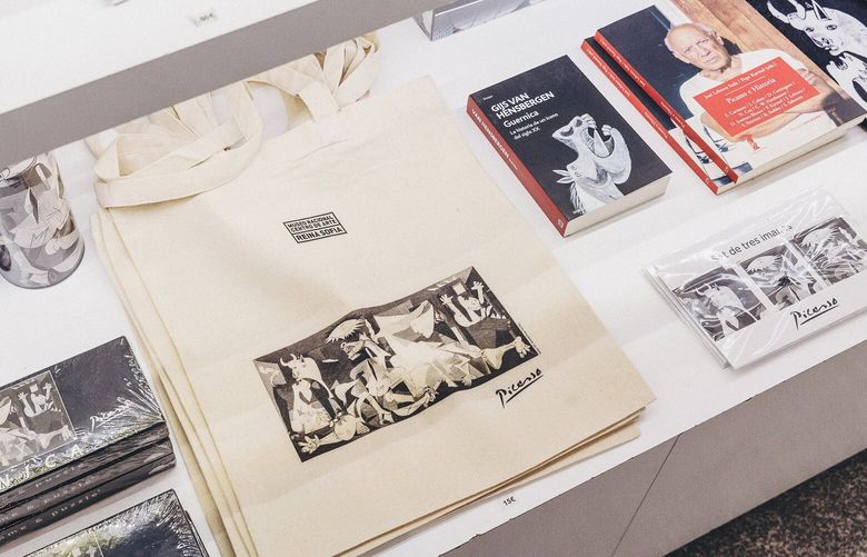 A section of the gift shop displaying merchandise featuring Pablo Picasso’s “Guernica,” at the Reina Sofía museum, in Madrid, Spain on Sept. 13, 2023. The Reina Sofía museum in Madrid has lifted its ban on photographing “Guernica,” saying it hopes to enhance the experience for those viewing the antiwar painting. (Ben Roberts/The New York Times) XNYT0576 XNYT0576
