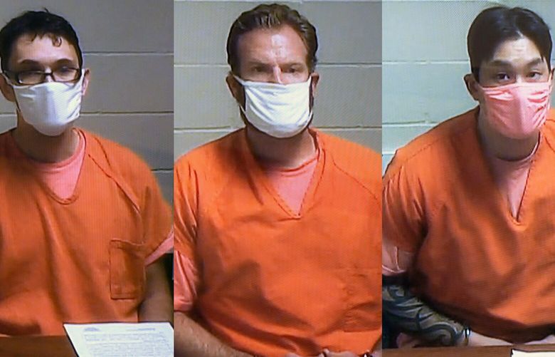 This photo combination shows Tacoma police officers Christopher Burbank, left, Matthew Collins, center, and Timothy Rankine via video during their arraignments in Pierce County Superior Court in Tacoma, Wash., Friday, May 28, 2021. Three Washington state police officers pleaded not guilty Friday in the death of Manuel Ellis, another Black man who pleaded for breath under an officer’s knee. (Tony Overman/The News Tribune via AP, Pool) WATAC107 WATAC107