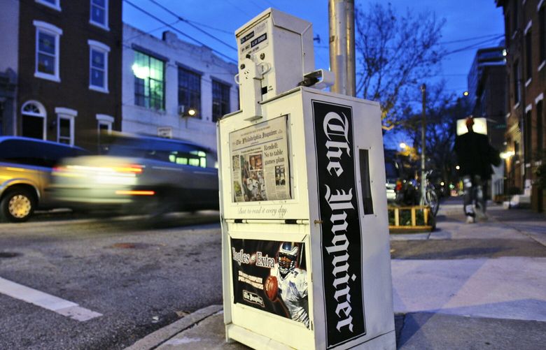 FILE – A Philadelphia Inquirer newspaper vending machine stands in Philadelphia on Nov. 30, 2006.  The Philadelphia Inquirer experienced the most significant disruption to its operations in 27 years due to what the newspaper calls a cyberattack on Sunday, May 14, 2023. The company was working to restore print operations after a cyber incursion that prevented the printing of the newspaper’s Sunday print edition, the Inquirer reported on its website.  (AP Photo/Matt Rourke, File )