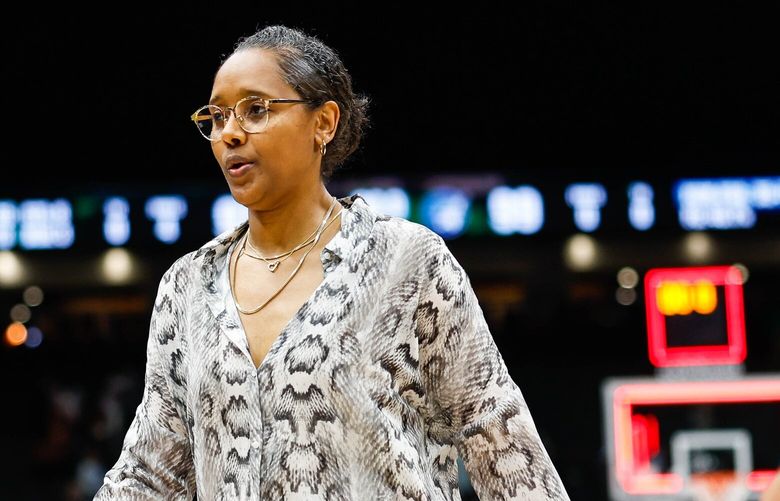 Seattle coach Noelle Quinn walks off the court after the Storm lose to Minnesota in overtime, 99-97. 224314