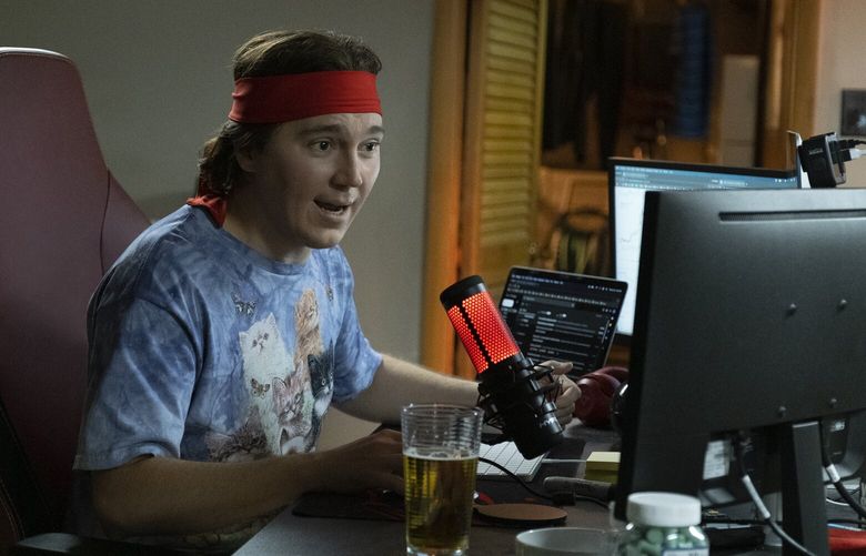 This image released by Sony Pictures shows Paul Dano as Keith Gill in a scene from “Dumb Money.” (Claire Folger/Sony Pictures via AP)