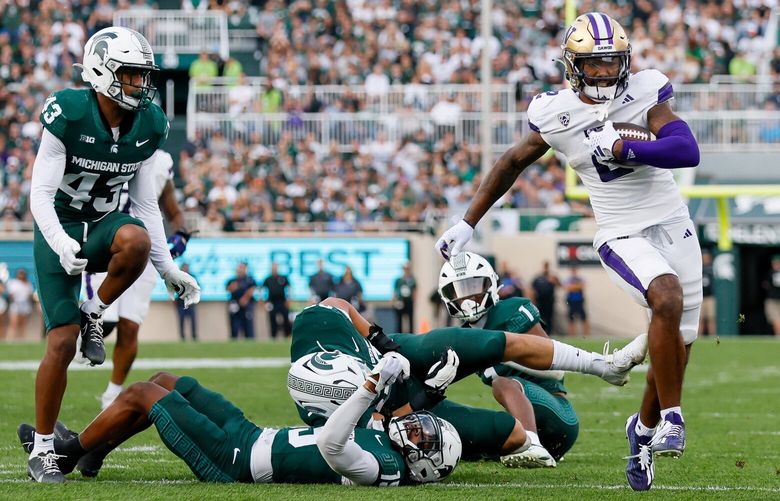 Washington Huskies wide receiver Ja’Lynn Polk leaves the Michigan State Spartans defense in his wake as he runs in for a touchdown during the second quarter Saturday, Sept. 16, 2023 in East Lansing, MI. 224978