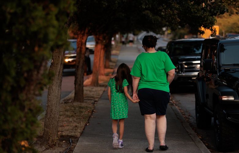 Susan walks with her daughter on a recent evening in the greater Seattle-area. “Sometimes people think an absence of discrimination and hostility is enough, but we can set our sights higher than that,” says Susan. “We can set a standard that trans kids can be valued and affirmed, not just left alone.” 224728