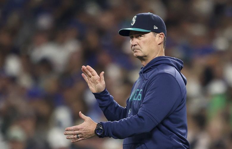 Seattle Mariners manager Scott Servais visits the mound during the sixth inning of a baseball game against the Los Angeles Dodgers, Saturday, Sept. 16, 2023, in Seattle. (AP Photo/Maddy Grassy) WAMG110 WAMG110