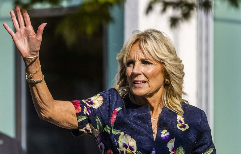 United States First Lady Dr. Jill Biden waves to a crowd as she exits the Pacific Science Center in Seattle on Saturday, Oct. 8, 2022.