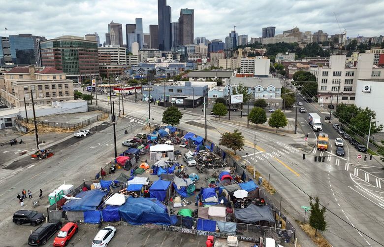 A homeless encampment sits on a piece of land between 6th Avenue South and Airport Way South on the border of Sodo and the Chinatown-International District. The area and its concentration of services for people experiencing homelessness has become a flash point for people in the Chinatown-International District.