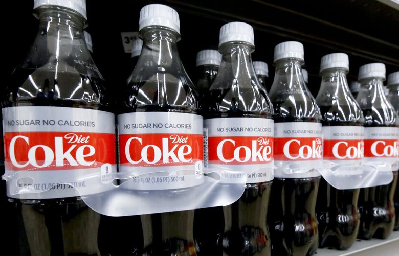 Bottles of Diet Coke sit on a shelf in a market in Pittsburgh, Wednesday, Aug. 8, 2018. (AP Photo/Gene J. Puskar) PAGP