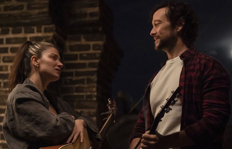This image released by Apple TV+ shows Eve Hewson, left, and Joseph Gordon-Levitt in a scene from “Flora and Son.” (Apple TV+ via AP) NYET124 NYET124
