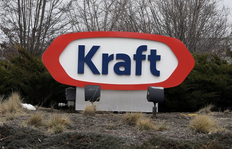 The Kraft logo appears outside of the headquarters on Wednesday, March 25, 2015, in Northfield, Ill. Some of the most familiar names in ketchup, pickles, cheese and hot dogs are set to come under the same roof after H.J. Heinz Co. announced plans to buy Kraft and create one of the world’s largest food and beverage companies. (AP Photo/Nam Y. Huh)