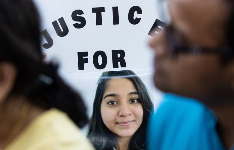 A protestor who asked not to be named holds a sign before marching Saturday, Sept. 16, 2023, from Denny Park to the site in which Jaahnavi Kandula was struck and killed in Seattle. This rally and others this past weekend in Seattle are in protest against insensitivity towards Jaahnavi Kandulan’s death by a Seattle Police Department Officer.