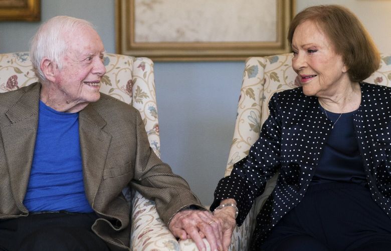 FILE — Former President Jimmy Carter and his wife, Rosalynn Carter, at home in Plains, Ga. on June 25, 2021. Carter was not suffering any particular ailment that prompted him to enter hospice care in February, but was tired of being in and out of the hospital. (Erin Schaff/The New York Times) XNYT0295