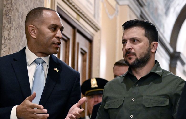 President Volodymyr Zelenskyy of Ukraine, center, is accompanied by House Minority Leader Hakeem Jeffries (D-N.Y.) as he arrives at the U.S. Capitol in Washington on Thursday morning, Sept. 21, 2023. (Kenny Holston/The New York Times) XNYT0545 XNYT0545