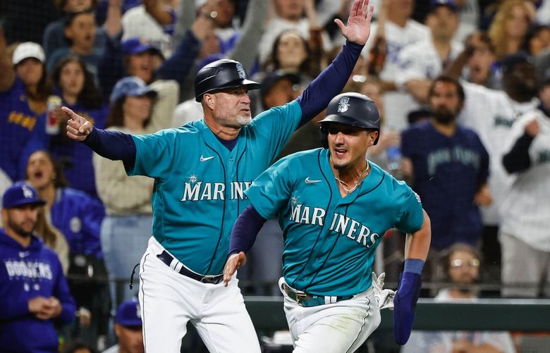 Josh Rojas scores on Mike Ford’s RBI single in the 10th to tie the game with LA.  The Los Angeles Dodgers played the Seattle Mariners in Major League Baseball Saturday, Sept. 16, 2023 at T-Mobile Park, in Seattle, WA. 224974