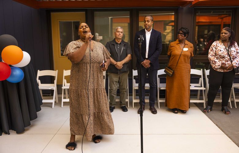 Talaya Logan, who grew up in Rainer Beach, sings “A Change is Gonna Come” by Sam Cooke at a celebration of the opening of the Elizabeth Thomas Homes. 
—
Photographed in Rainer Beach in Seattle on Thursday, Sept. 21, 2023.