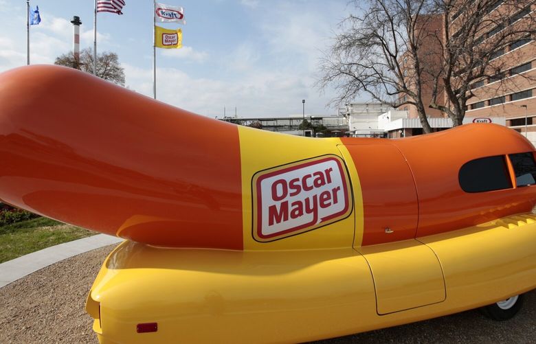 FILE – The Oscar Mayer Wienermobile sits outside the the Oscar Meyer headquarters, Oct. 27, 2014, in Madison, Wis. On Wednesday, Sept. 20, 2023, four months after announcing that the hot dog-shaped Wienermobile was changing its name to the Frankmobile, Oscar Meyer said that the one-of-a-kind wiener on wheels is reverting to the original. (M.P. King/Wisconsin State Journal via AP, File) WIMAW401 WIMAW401