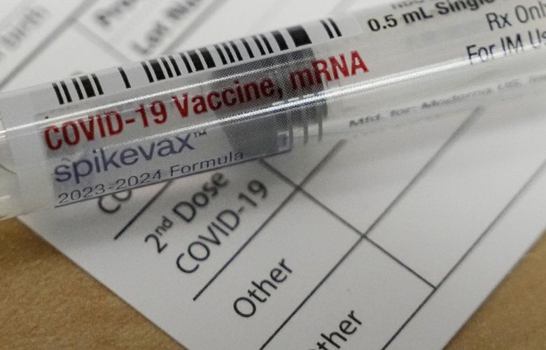 FILE – A Moderna Spikevax COVID-19 vaccine is seen at a drugstore in Cypress, Texas on Wednesday, Sept. 20, 2023. Since the Centers for Disease Control and Prevention signed off on them for ages 6 months and up in September 2023, people seeking the newest COVID-19 vaccine are running into high demand, insurance headaches and supply delays coast to coast. (Melissa Phillip/Houston Chronicle via AP, File) TXHOU801 TXHOU801