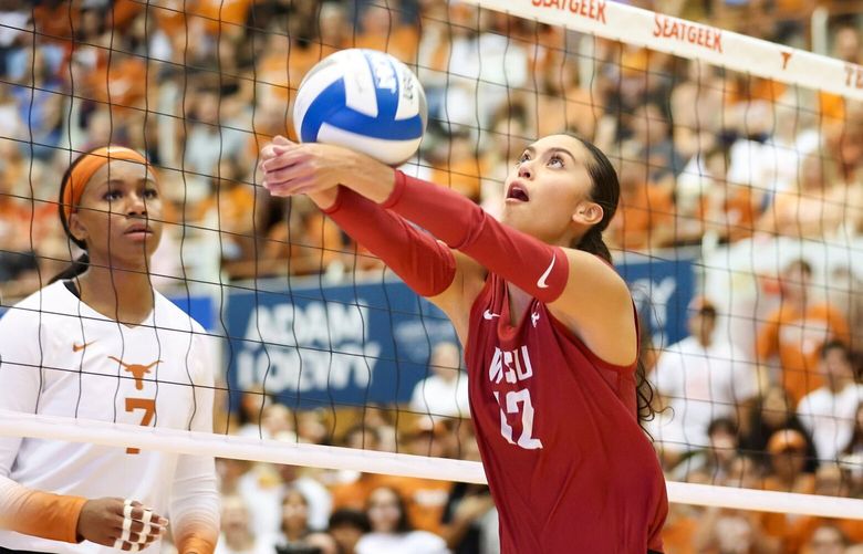 WSU’s Argentina Ung sets the ball during a match against No. 6 Texas on Sept. 15. The Cougars took down the defending champion Longhorns and moved to No. 7 in the country, before sweeping UW on Thursday.