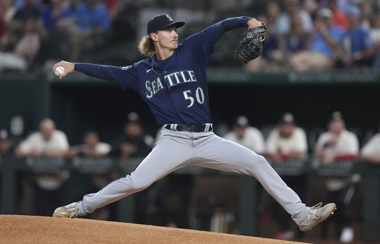 Seattle Mariners starting pitcher Bryce Miller throws to a Texas Rangers batter during the first inning of a baseball game in Arlington, Texas, Friday, Sept. 22, 2023. (AP Photo/LM Otero) TXMO104 TXMO104