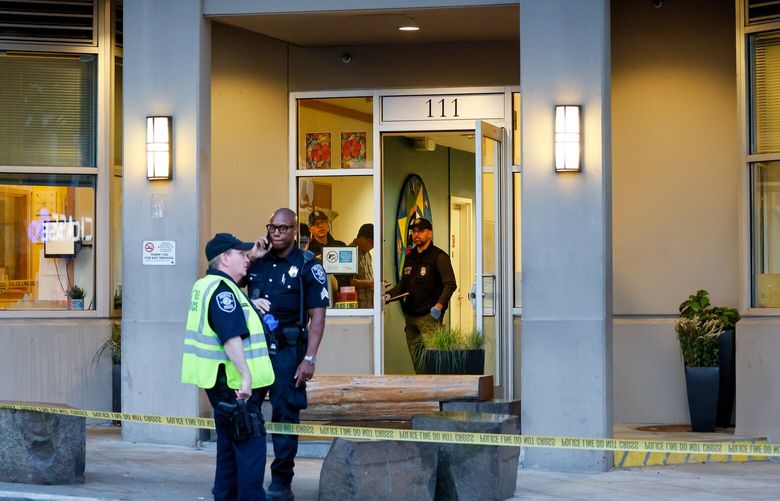 Seattle Police officers gather at the A.L. Humphrey House after reports of a fatal stabbing Friday, Sept. 22, 2023 in Seattle. 225059