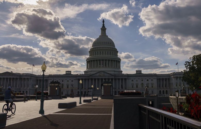 FILE – The Capitol is seen in Washington, Sept. 20, 2021. The federal government is heading toward a shutdown that will disrupt many services, squeeze workers and roil politics. (AP Photo/J. Scott Applewhite, File) WX206 WX206
