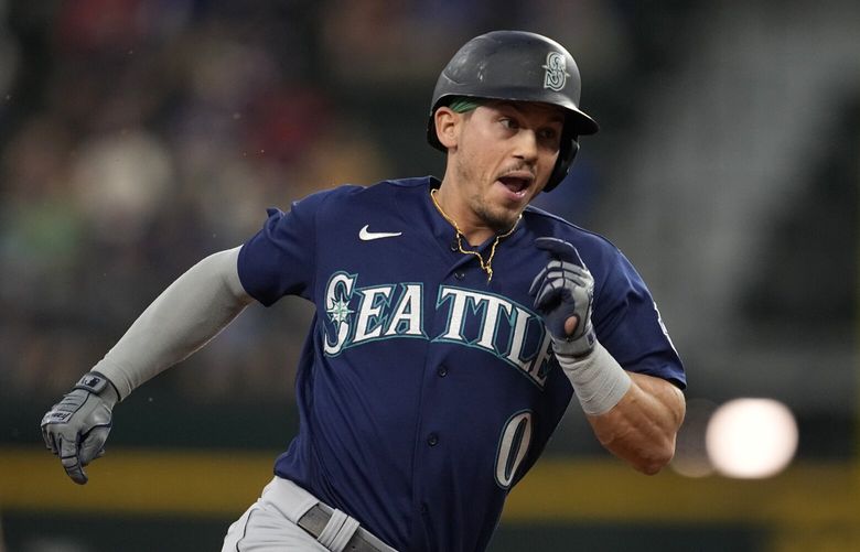 Seattle Mariners’ Sam Haggerty sprints to third after hitting a run-scoring triple on a pinch-hit appearance in the sixth inning of a baseball game against the Texas Rangers, Sunday, Sept. 24, 2023, in Arlington, Texas. Jarred Kelenic scored on the hit. (AP Photo/Tony Gutierrez)