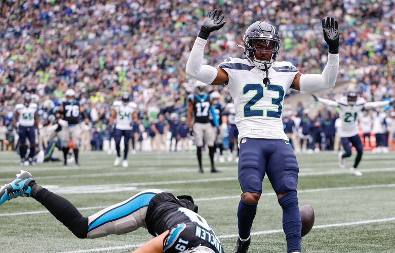 Seattle cornerback Artie Burns breaks up the pass intended for Carolina’s Adam Thielen in the second quarter.  The Carolina Panthers played the Seattle Seahawks in NFL Football Sunday, Sept. 24, 2023, at Lumen Field in Seattle, WA. 225064