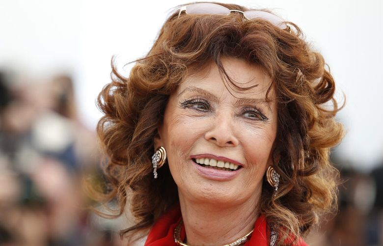 FILE – Italian actress Sophia Loren smiles during a photo call for “Human Voice,” (Voce Umana) at the 67th international film festival, Cannes, southern France, on May 21, 2014. Film legend Sophia Loren is recovering from successful surgery for a leg fracture after she fell in her Switzerland home, an agent for the 89-year-old Italian actor said Monday, Sept. 25, 2023. (AP Photo/Alastair Grant, File) LBL104 LBL104
