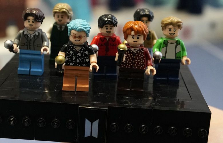 FILE – A LEGO set made of its blocks featuring K-pop band BTS, is shown during a publicity event at a store in Seoul, South Korea, on March 2, 2023. Danish toymaker Lego said Monday Sept. 25, 2023 that an experiment to make its colorful building bricks out of recycled drinks bottles didn’t work but the world’s largest toymaker “remains committed” to its plans to find sustainable materials to reduce carbon emission. (AP Photo/Lee Jin-man, File) LGK106 LGK106