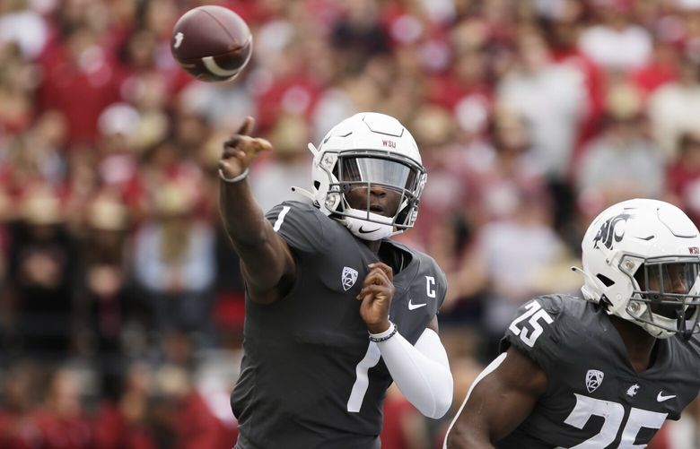 Washington State quarterback Cameron Ward (1) throws a pass during the first half of an NCAA college football game against Oregon State, Saturday, Sept. 23, 2023, in Pullman, Wash. (AP Photo/Young Kwak)