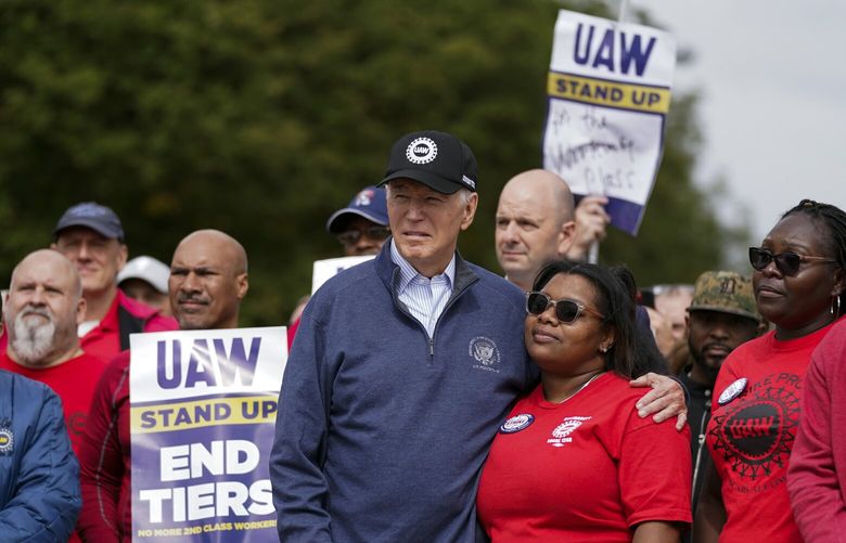 President Joe Biden joins striking United Auto Workers on the picket line, Tuesday, Sept. 26, 2023, in Van Buren Township, Mich. (AP Photo/Evan Vucci) MIEV454 MIEV454