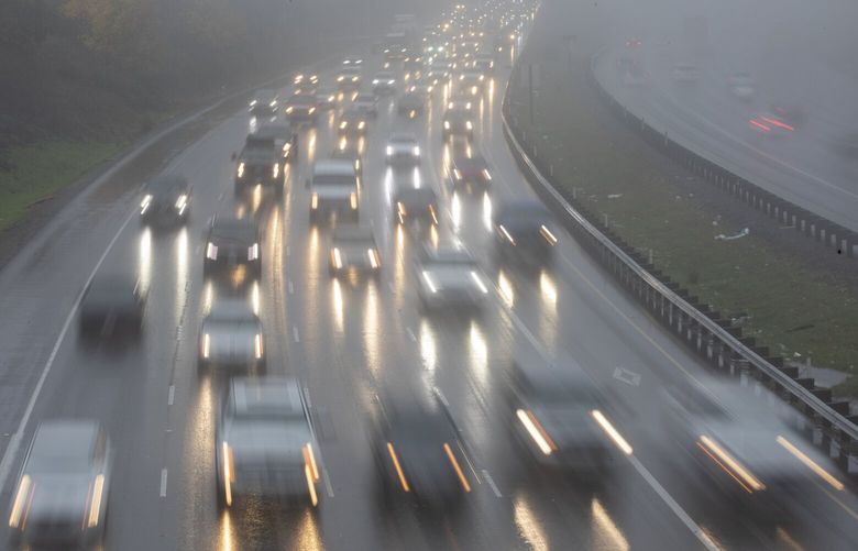 Cars at head southbound on a rain-soaked I-5, shot from the overpass at S. 200th St. in Des Moines, Thursday, November 11, 2021. Rain is predicted to fall through next Tuesday. 218810