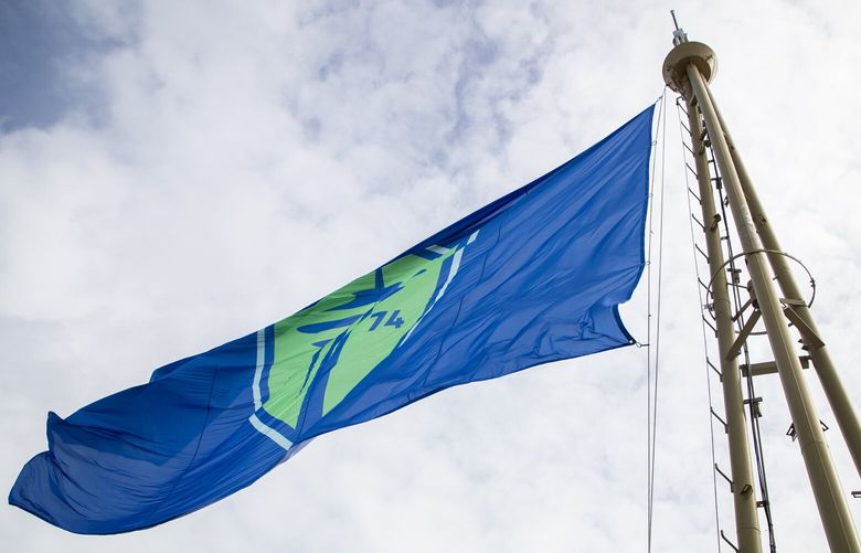 Sounders FC’s new logo is displayed on a giant 20’ x 30’ club flag above Seattle’s iconic Space Needle Tuesday, Sept. 26, 2023, on a rainy day in Seattle.