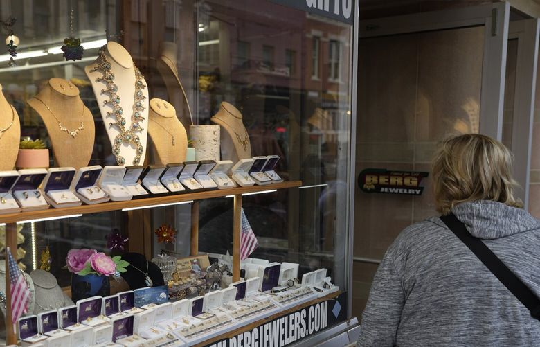 A shopper looks at items in the window of a jewelry store on Main Street Wednesday, Sept. 20, 2023, in Deadwood, S.D. On Tuesday, the Conference Board reports on U.S. consumer confidence for September. (AP Photo/David Zalubowski) 