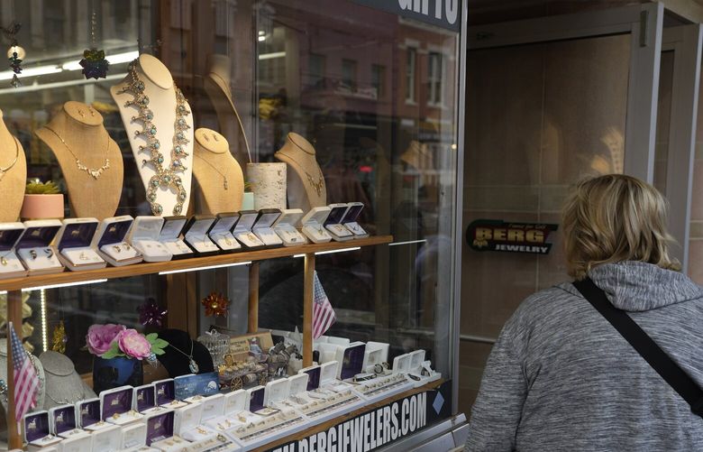 A shopper looks at items in the window of a jewelry store on Main Street Wednesday, Sept. 20, 2023, in Deadwood, S.D. On Tuesday, the Conference Board reports on U.S. consumer confidence for September. (AP Photo/David Zalubowski)