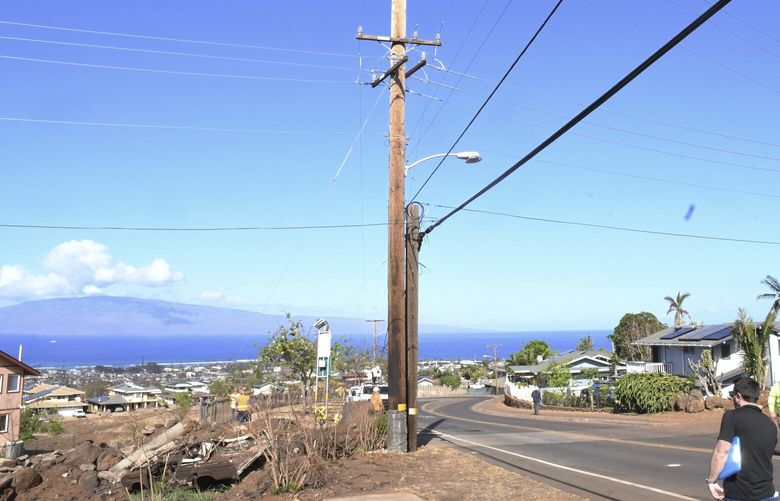 This photo provided by the Morgan & Morgan law firm shows a Hawaiian Electric pole on Lahainialuna Road where downed power lines sparked an initial fire shortly after dawn on Aug. 8., 2023, in Lahaina, Maui, Hawaii, seen on Aug. 29, 2023. Investigators are examining pieces of evidence as they seek to solve the mystery of how a small, wind-whipped fire sparked by downed power lines and declared extinguished flare up again hours later into a devastating inferno. (Morgan & Morgan via AP) NY726 NY726