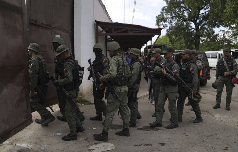 Soldiers raid the Tocorón Penitentiary Center, in Tocorón, Venezuela, Wednesday, Sept. 20, 2023. Soldiers carried out the prison raid in an effort to dismantle one of the largest criminal gangs in the country, according to Interior Minister Admiral Remigio Ceballos. (AP Photo/Ariana Cubillos) XAC102 XAC102