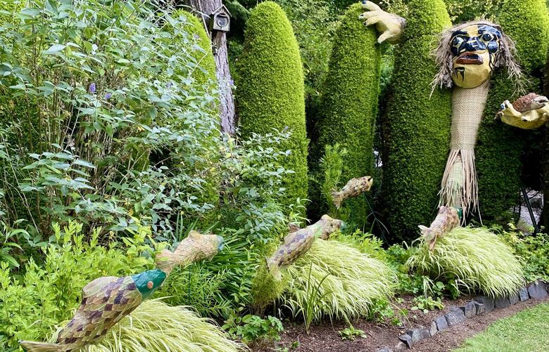 These sculptures displayed at Haunted Heronswood tell the story of KaiKaiax calling the salmon to him. The fish scales are made of rhododendron leaves.